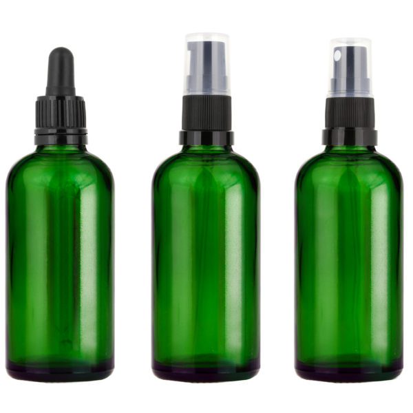 Grön glasflaska med pipett, pump eller spray